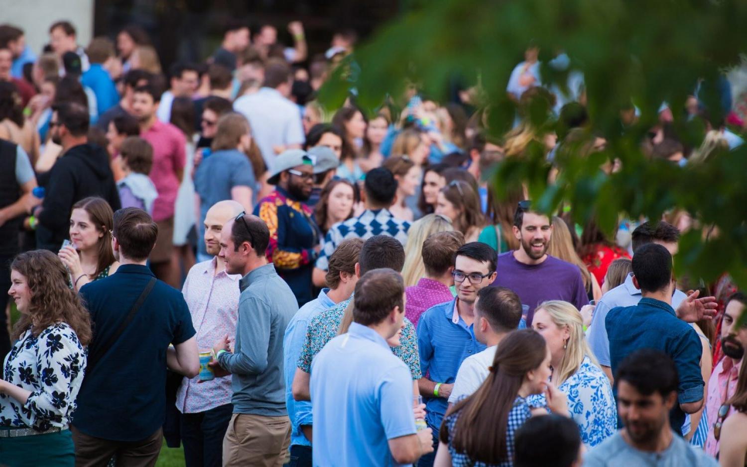 six people standing arm in arm in front of gasson hall